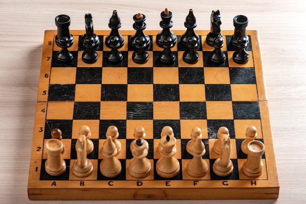 Vintage wooden chess board and figures