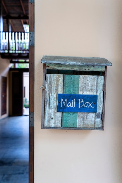 Vintage wooden mail box on wall. Thailand, close up