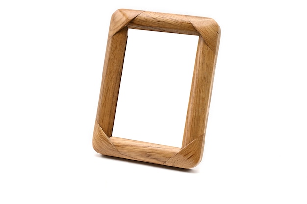 Vintage wooden photo frame on an isolated white background.
