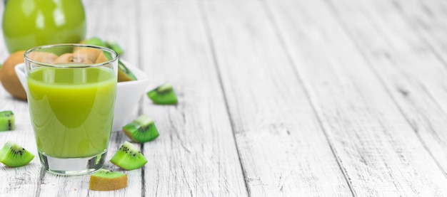 Vintage wooden table with fresh made Kiwi Smoothies