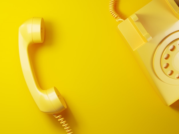 Photo vintage yellow phone receiver on yellow background 3d