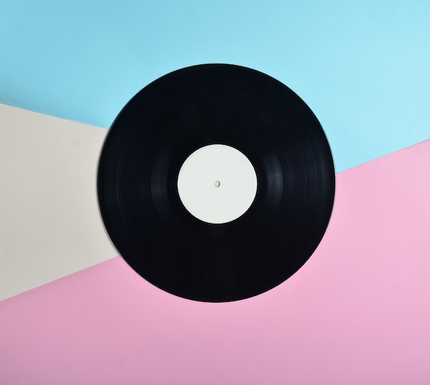 Vinyl plate on a colored pastel, retro music technology