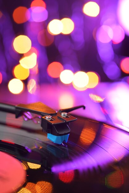 Vinyl player turntable with lp record and blured lights