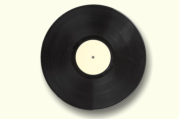 Vinyl record on a colored background. Old vintage vinyl record isolated