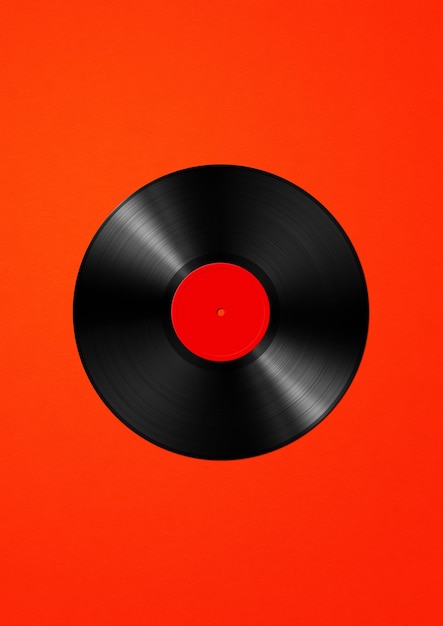 Vinyl record isolated on red background