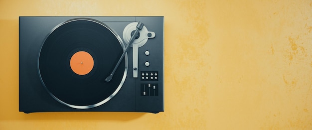 Vinyl record player on orange background