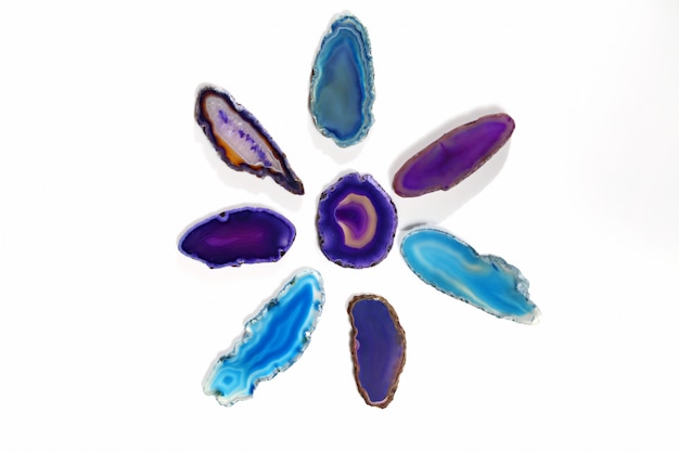 violet and  blue agate stones on white background 