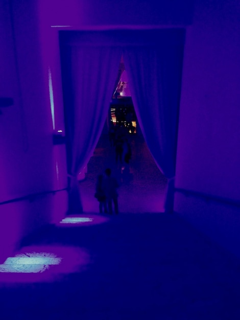 Violet corridor in purple neon light