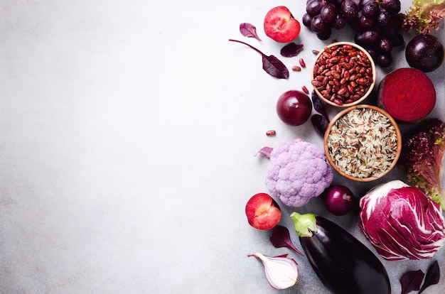 Violet eggplant, beets, cauliflower, purple beans, plums, onion, cabbage, grape, quinoa, rice. Ingredients for cooking