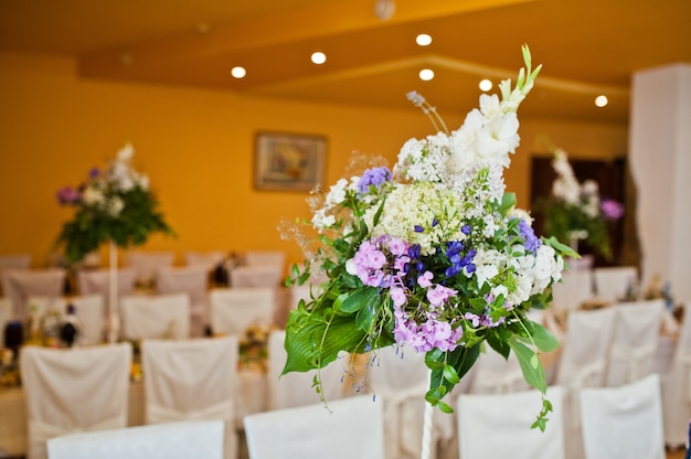 Violet lilac flowers on wedding table