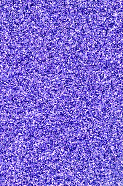 Violette decoratieve pailletten. afbeelding met glanzende bokeh lichten van kleine elementen