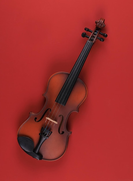 violin isolated on red background