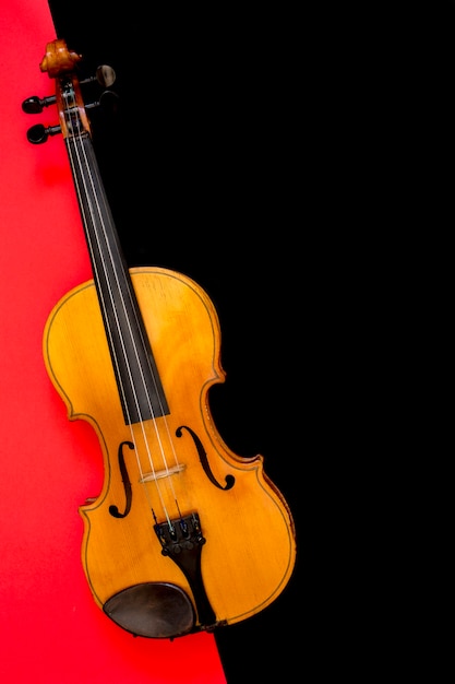 Violin on a multi-colored background, top view