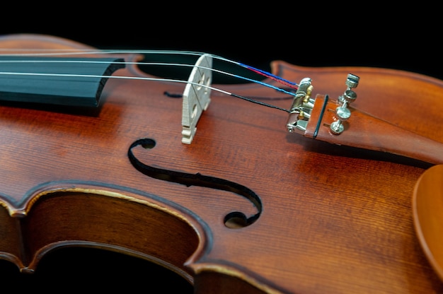 Violin musical instrument close up isolated on black