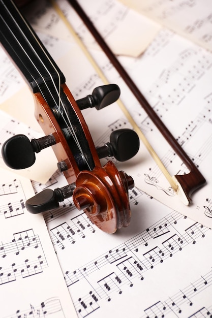 Foto vioolhals op muziekdocumenten achtergrond