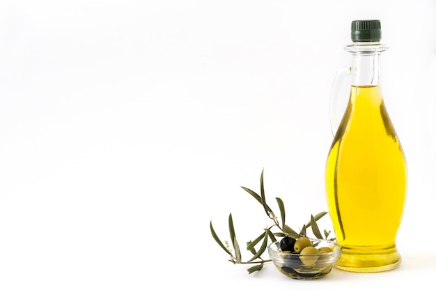 Virgin olive oil in a crystal bottle isolated on white