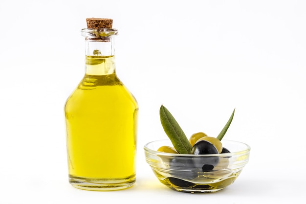 Virgin olive oil in a crystal bottle isolated on white