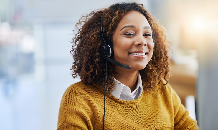 Photo virtual assistant crm or friendly woman in call center consulting speaking or talking at customer services contact us happy smile or sales consultant in telemarketing or telecom company help desk