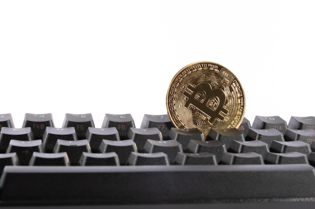 Virtual Bitcoin and Ethereum coins currency finance money on computer keyboard