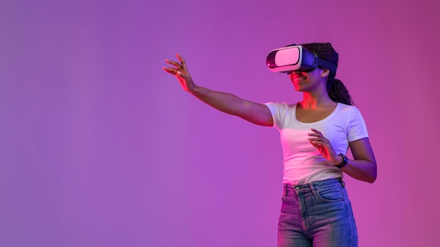 Virtual Experience Smiling Black Lady Playing Video Game In VR Headset