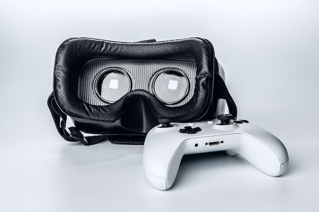 Virtual Reality glasses and game pad Isolated .