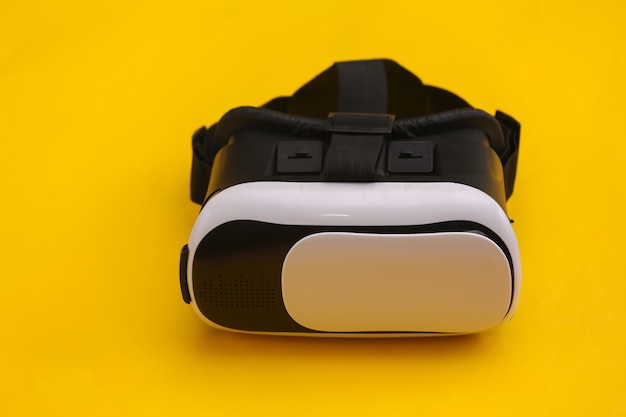 Virtual reality headset on yellow background. Modern gadgets