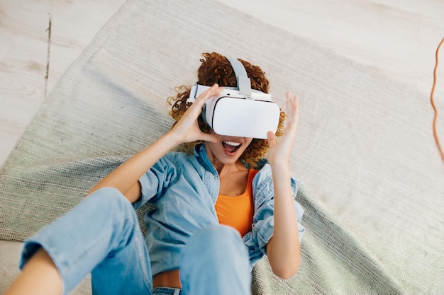 Virtual reality joy female person enjoying futuristic vr game at home indoors