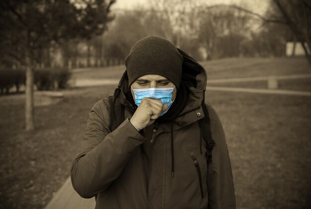 Virus outbreak. Man in mask outdoors. Dangerous flu strain cases. Pandemic disease. Health problem concept.