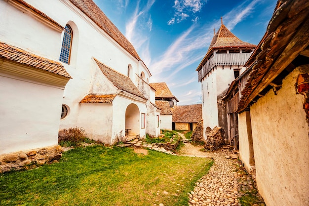 Viscri Romania Blue old painted traditional house from village Transylvania German Saxon community Unesco The Viscri fortified church