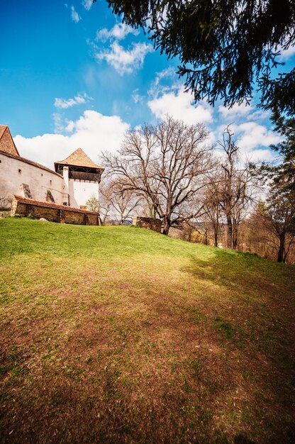 Viscri Romania Blue old painted traditional house from village Transylvania German Saxon community Unesco The Viscri fortified church