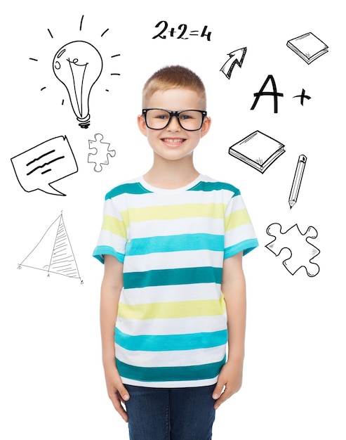 Photo vision, education and school concept - smiling little boy in eyeglasses over white background