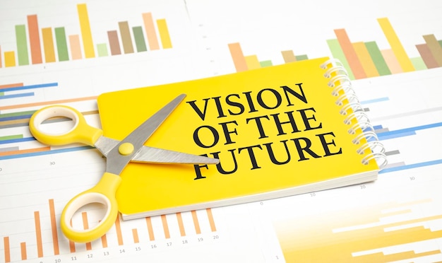 Vision of the future words on yellow sticker and charts
