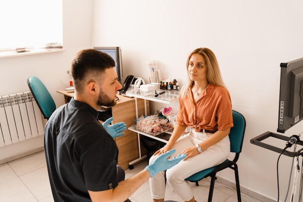 Visiting ENT doctor for examination of the state of health of the ear throat and nose Consultation of woman with otolaryngologist in a medical clinic