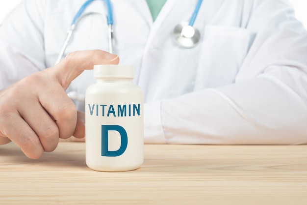vitamin d and supplements for human health. doctor recommends taking vitamin d. doctor talks about benefits of vitamin d. essential vitamins and minerals for humans. d vitamin health concept.