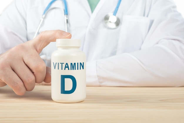 Vitamin D and supplements for human health. Doctor recommends taking vitamin D. doctor talks about Benefits of vitamin D. Essential vitamins and minerals for humans. D Vitamin Health Concept.