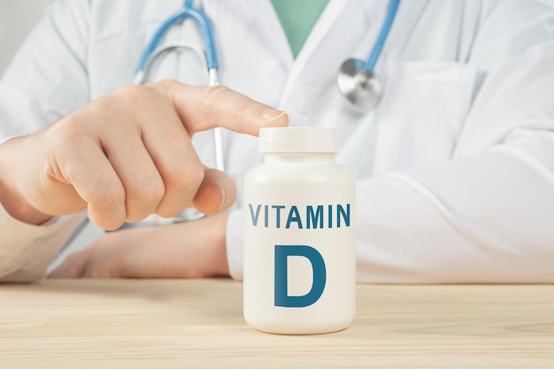 Vitamin D and supplements for human health. Doctor recommends taking vitamin D. doctor talks about Benefits of vitamin D. Essential vitamins and minerals for humans. D Vitamin Health Concept.