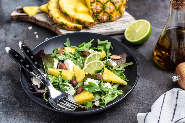 Vitamin salad of leaves of pineapple, blue cheese. almond