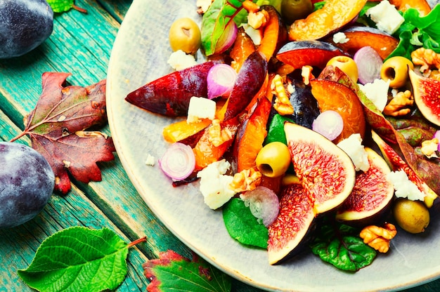 Vitamin salad with fruit olives and herbs