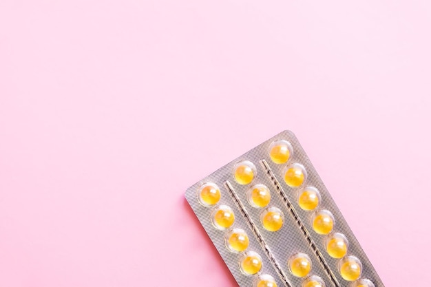 Vitamins pink in the package on a pink background.