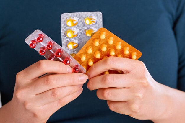 Vitamins And Supplements Closeup Of Woman Hands Holding Variety Of Colorful Vitamin Pills