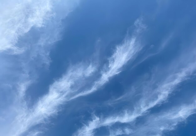 Vivid blue canvas adorned with fluffy white clouds a serene glimpse of natures artistry