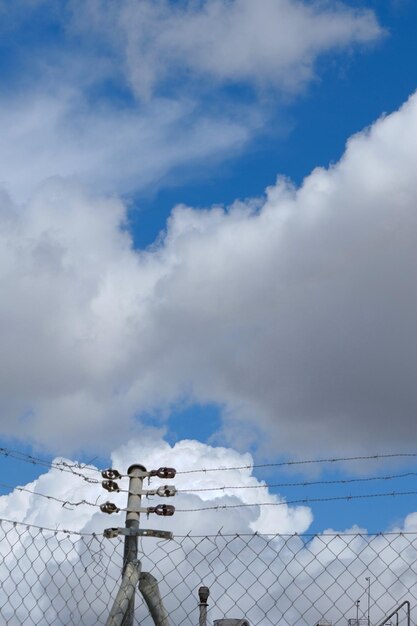 Vivid cloudscape with metallic net down Conceptual limits border loneliness jail Background stories