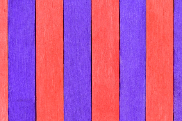 Vivid colorful red and purple wood planks texture or background