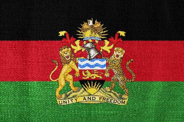 Vlag en wapenschild van de Republiek Malawi op een gestructureerde achtergrond Concept collage