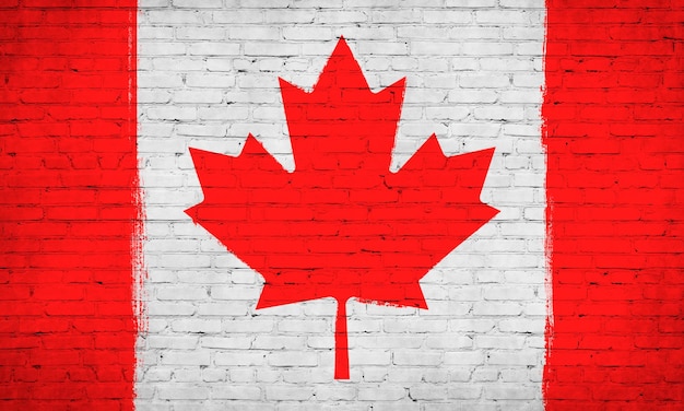 Vlag van Canada geschilderd op bakstenen muur Achtergrondfoto nationale vlag