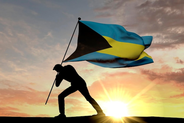 Vlag van de Bahama's wordt in de grond geduwd door een mannelijk silhouet 3D-rendering