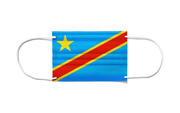 Foto vlag van de democratische republiek congo op een chirurgisch wegwerpmasker. wit oppervlak geïsoleerd