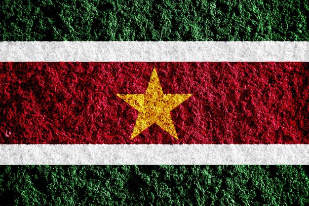 Vlag van de Republiek Suriname op een gestructureerde achtergrond Concept collage