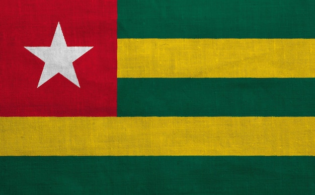 Vlag van de Togolese Republiek op een gestructureerde achtergrond Concept collage