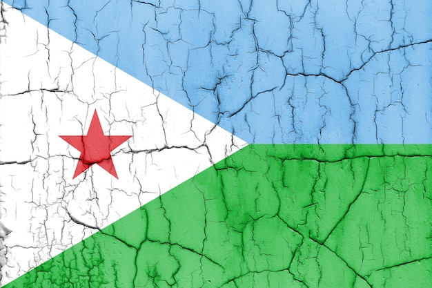 Vlag van Djibouti op gebarsten muur gestructureerde achtergrond